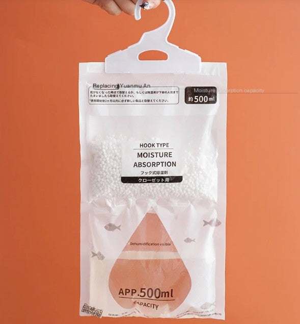 Hanging dehumidifier bag with built-in hook absorbing moisture in closet to prevent mold and odors