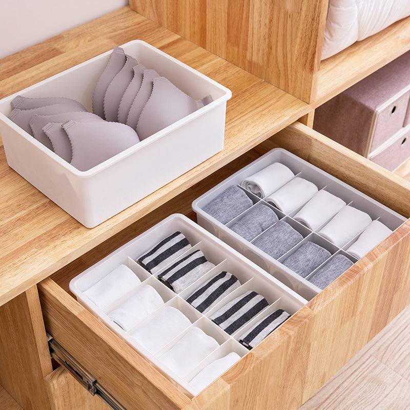 Modular beige and gray drawer organizer tray for storage and sorting small items in bedroom and closet drawers