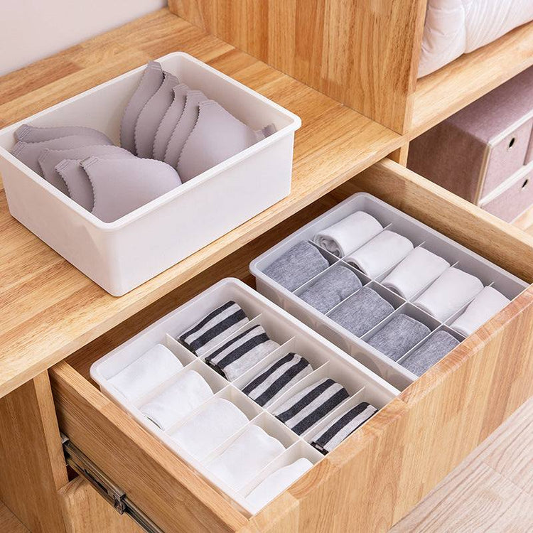 Modular beige and gray drawer organizer tray for storage and sorting small items in bedroom and closet drawers