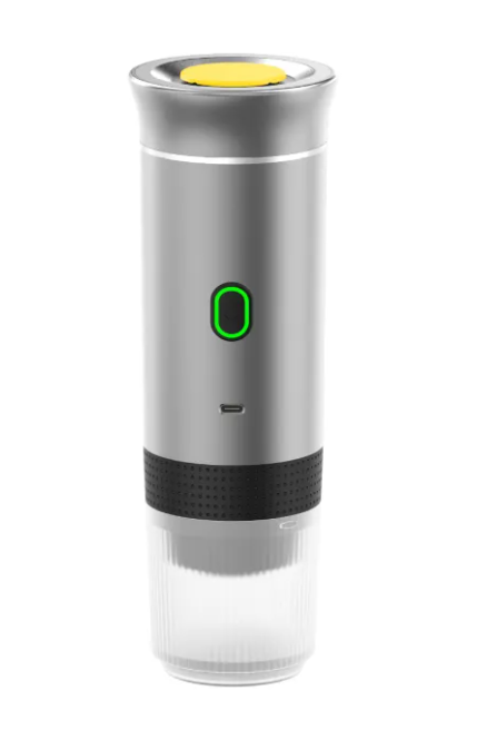 Portable capsule coffee machine brewing espresso shot outdoors with rechargeable battery and compact design