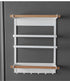 Magnetic kitchen towel rack and storage organizer mounted on refrigerator holding paper towels and spices