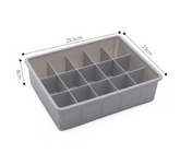 Drawer organizer tray made of durable polypropylene plastic for customizable storage in drawers, available in beige and gray.