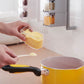 Wall-mounted Creative Multi-Functional Kitchen Seasoning Box with multiple tiers holding spice jars and condiment bottles in a modern kitchen setting